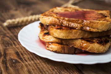 stack of french toast on wooden background