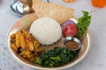 Selective focus of Dal Bhat rice a vegetarian Nepali Thali set, traditional dinner dish of Nepal.