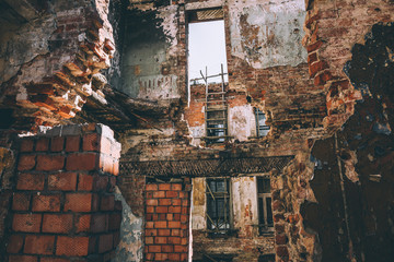 Ruined building, old ruins of brick house broken by war, earthquake or other natural disaster. Demolition building concept