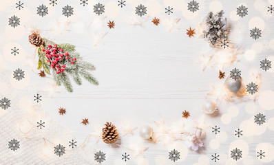 Star shaped Christmas lights with white knitted scarf and Christmas decorations, bokeh, and black snowflakes on white wooden rustic background, abstract, top view, flat lay