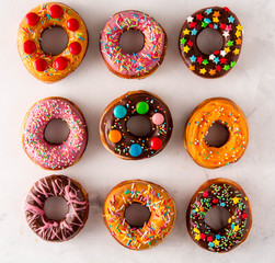 Donuts Set Isolated on White Background. You get different type of donuts: with chocolate, pink, with stripes,with syrup and sugar powder.