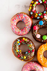 Donuts Set Isolated on White Background. You get different type of donuts: with chocolate, pink, with stripes,with syrup and sugar powder.