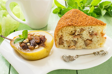 Delicious dessert: baked pear with raisins, dates, honey and apple pie
