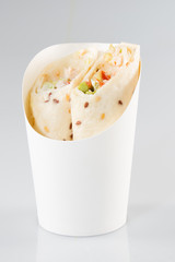 Healthy lunch snack. Tortilla wraps with grilled chicken fillet and fresh vegetables