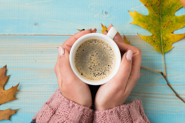 hands holding cup coffee