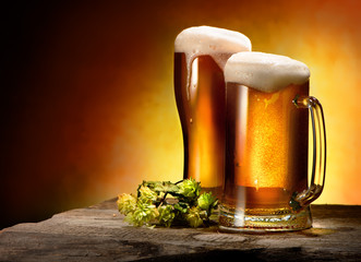 Two glasses of beer and hops