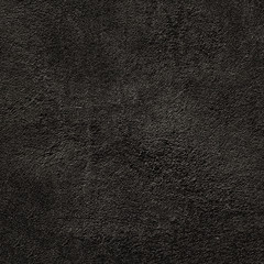 Black wall texture of natural cement, concrete wall. Old concrete wall as banner,  grunge wallpaper,, aged stone material, close-up..