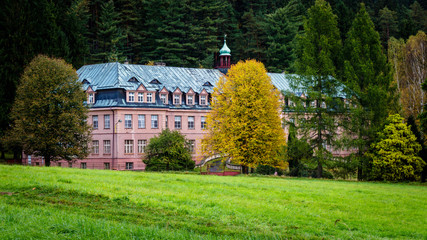 Abandoned children's home near the town of Jetrichovice on a golden October day, Bohemian...