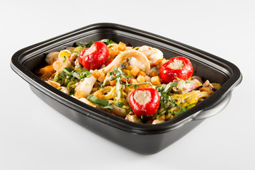 Lunch containers with vegetable salad and fresh food