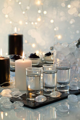 Festive buffet with vodka, black cavier and candles. Celebration concept for Christmas, new year or...
