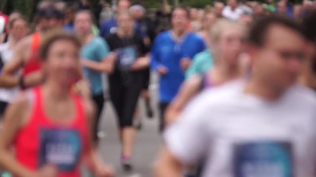 blurred footage of marathon runners at a running event