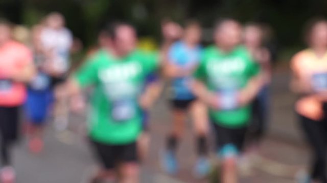 blurred footage of marathon runners at a running event