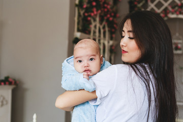 Young asian mother and baby in the room