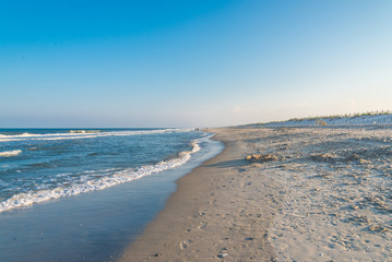 Fototapeta na wymiar Ocean surf at sandy beach