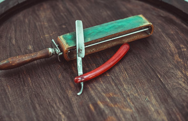 Vintage dangerous razor with leather sharpener