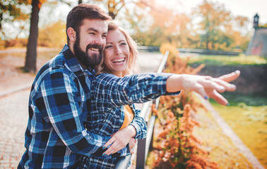 Meeting in the park. Romantic couple in the autumn park. Love, dating, romance