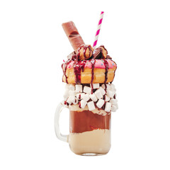 Chocolate and donuts extreme milkshake with marshmallow and other sweets in mason jar isolated on...