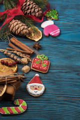 Homemade ginger cookies for new years and christmas on wooden background, xmas theme