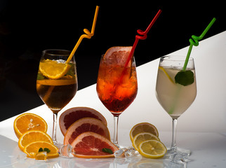 cocktail or colorful drink with fruit slices