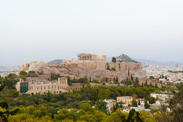View to Parthenon, Akropolis from Filopappou Hill or Hill of the Muses at sunset on sunny summer day