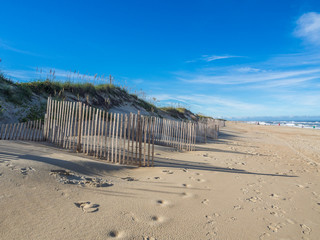 Wood fence at the sandy beach of Hatteras Island © oldmn
