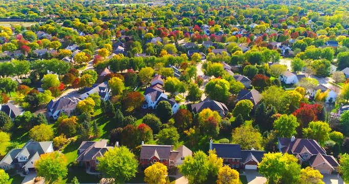 Beautiful neighborhoods, homes amid Autumn colors, aerial view.
