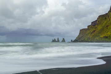 Fototapeta na wymiar Reynisdrangar rock formations at black Reynisfjara Beach, Iceland