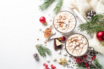 Christmas hot chocolate or cocoa with marshmallow on white.