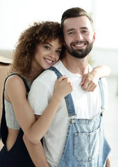 Close-up portrait of a newly-married couple in work clothes