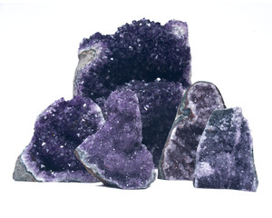 Collection of amethyst druse geodes isolated on white background