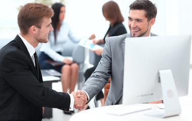 handshake Manager and the client in the office.