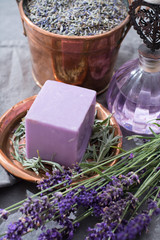Obraz na płótnie Canvas Lavender soap and perfume oil, made from fresh lavender flowers, aroma spa treathment and bodycare for women