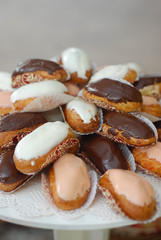 French dessert with Chocolate Eclairs stuffed with cream at a party