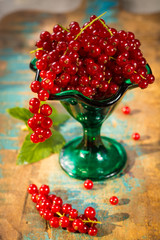 Fototapeta na wymiar Fresh ripe red currant berries on the table