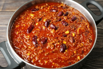 Saucepan with delicious chili con carne, close up
