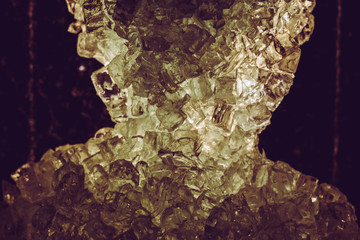 Obraz premium freezing macro close up melting ice golden shining glass