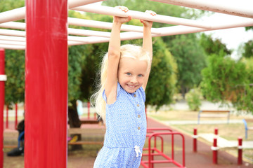 Fototapeta premium Cute little girl on playground