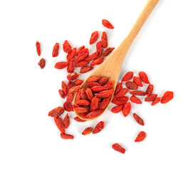 Wooden spoon with red dried goji berries on white background