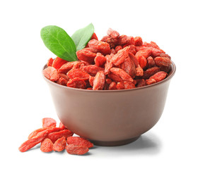 Bowl with red dried goji berries on white background