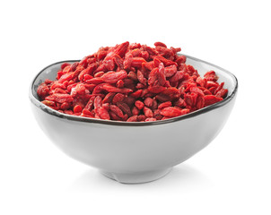Bowl with red dried goji berries on white background