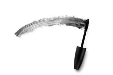 Brush and stroke of mascara on white background