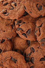 Many delicious oatmeal cookies with chocolate chips, closeup