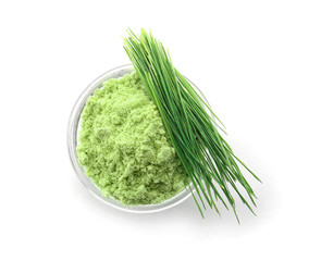 Bowl with wheat grass powder and sprouts, isolated on white