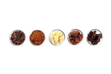 Bowls with different cocoa products on white background