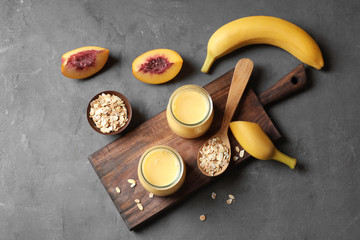 Obraz na płótnie Canvas Jars with fruit protein shakes on table