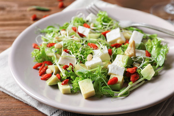 Plate with delicious goji berry salad, closeup