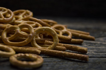 Pretzel round and pretzel sticks on wooden table