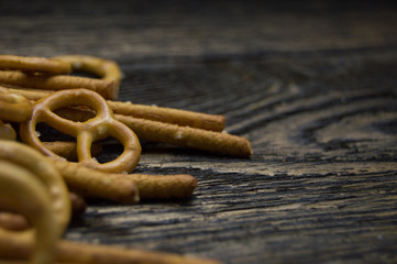 Pretzel hard and pretzel sticks on grunge wooden table