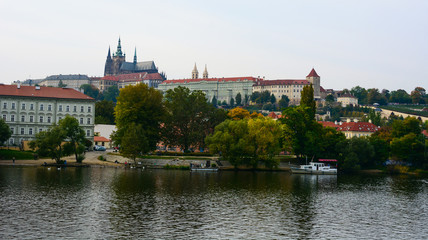 Cityscape of Prague, Czech Republic. Vltava river, Old Town, hills and the Metropolitan Cathedral of Saints Vitus, Wenceslaus and Adalbert