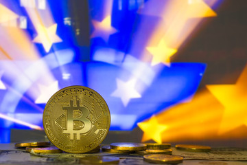 Bitcoins with money sonnets against the background of the european flag, the European Union of the...